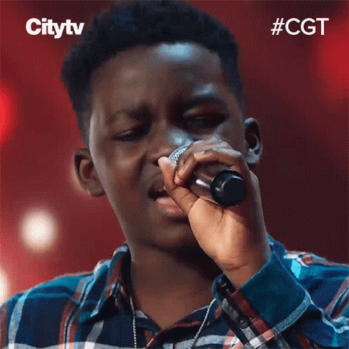 Young Man Singing Into Microphone