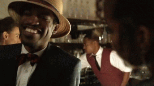 Young Man Singing Into Microphone On Stage With NBC Logo GIF