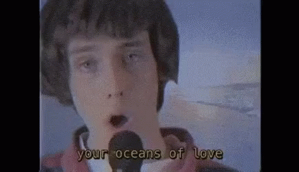 Young Man Singing Into Microphone Your Oceans Of Love GIF