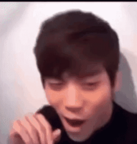 Young Man Singing with Funny Face