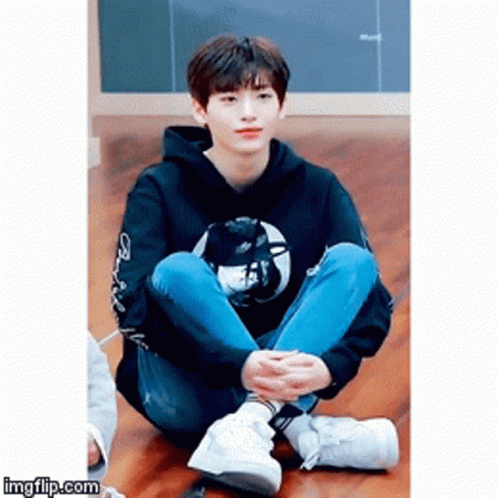 Young Man Sitting Cross-Legged