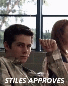 Young Man Sitting Next to Woman in Classroom Stiles Approves