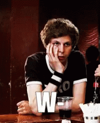 Young Man Sitting With Soda And W Letter GIF