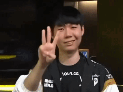 Young Man Smiling and Giving Peace Sign