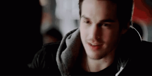 Young Man Smiling in Black Hoodie