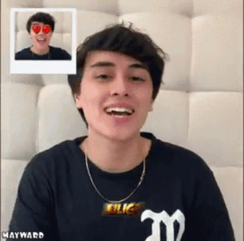 Young Man Smiling In Black Shirt With M GIF