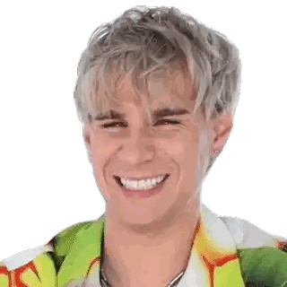 Young Man Smiling in Green and Yellow Shirt