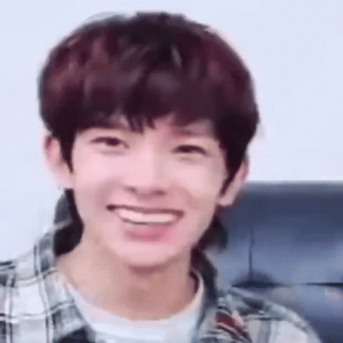 Young Man Smiling In Plaid And White Shirt GIF