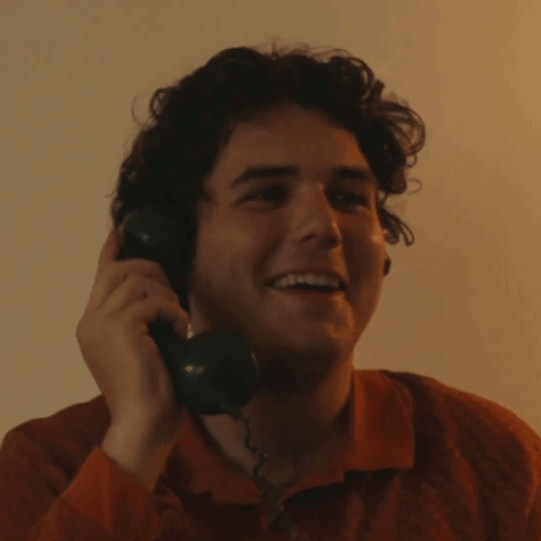Young Man Smiling on Phone