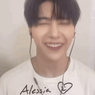 Young Man Smiling With Headphones GIF