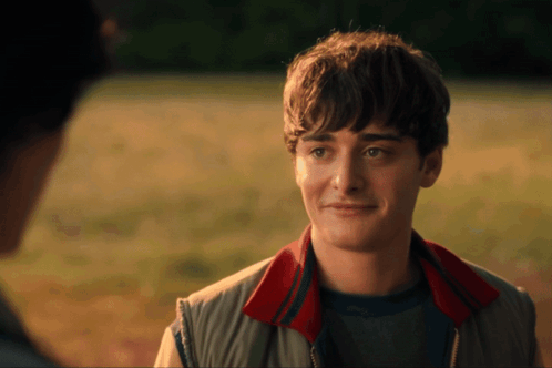 Young Man Smiling with Red Collar