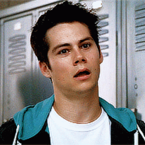 Young Man Standing in Front of Lockers With Letter A