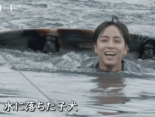 Young Man Swimming in Water with Chinese Writing