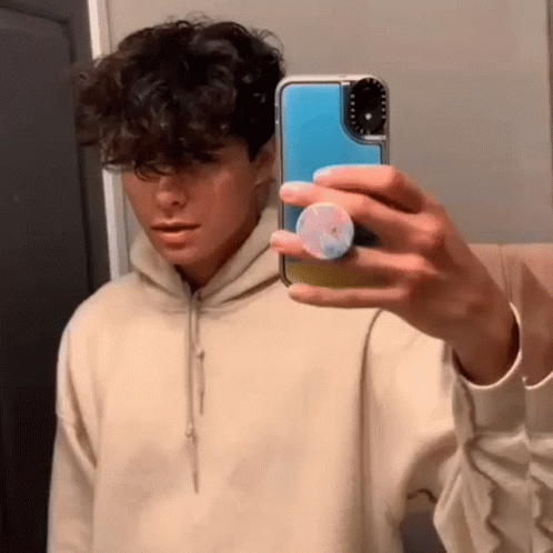 Young Man Taking Mirror Selfie GIF