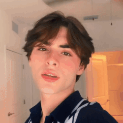Young Man Taking Selfie in Room