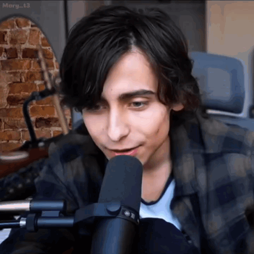 Young Man Talking Into Microphone GIF