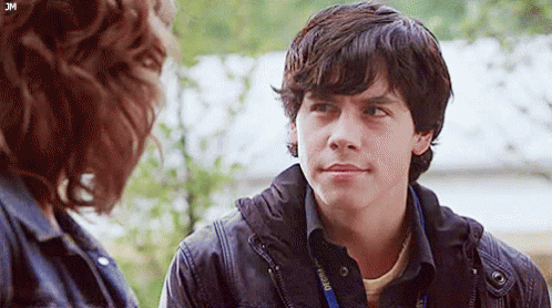 Young Man Talking To Woman With Lanyard GIF