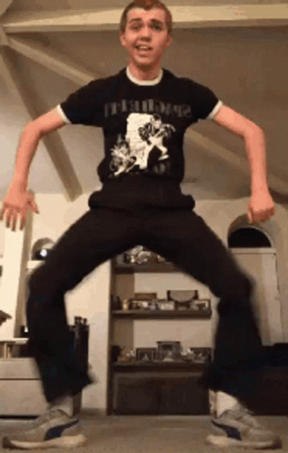 Young Man Wearing Damaged Man T-Shirt GIF