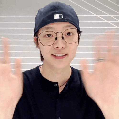 Young Man Wearing Glasses and A Hat