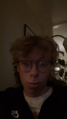 Young Man Wearing Glasses And Nike Sweatshirt GIF