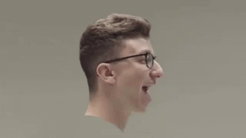 Young Man Wearing Glasses Holding Baseball Bat