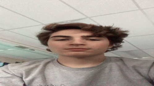 Young Man Wearing Grey Vision Shirt