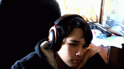 Young Man Wearing Headphones Looking Down