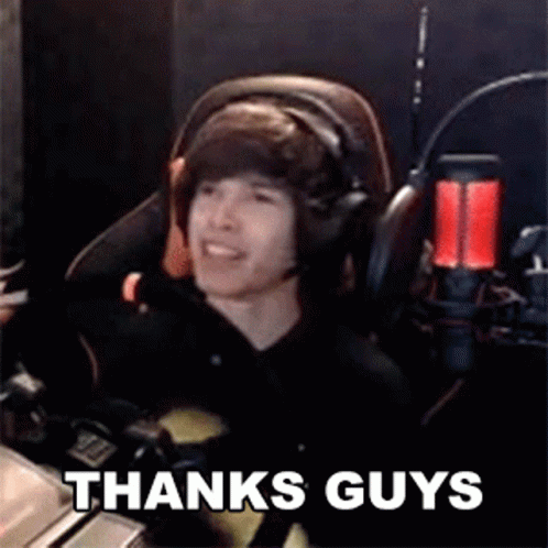 Young Man Wearing Headphones Sitting in Front of Microphone Saying Thanks Guys