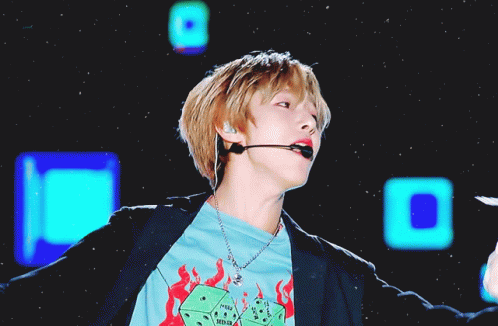 Young Man Wearing Microphone and I'm a Winner Shirt