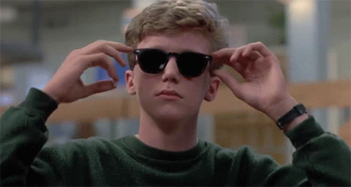 Young Man Wearing Sunglasses and Watch