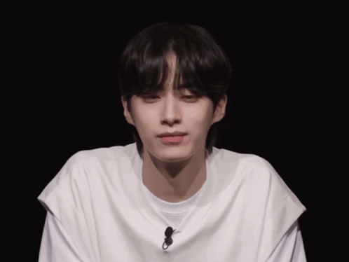 Young Man Wearing White T-Shirt with Microphone