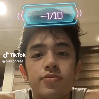 Young Man with 1/10 Sticker on Head