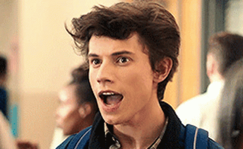 Young Man With Backpack Making Funny Face