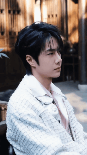 Young Man With Black Hair And White Jacket GIF