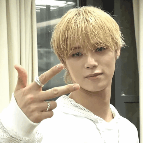Young Man With Blonde Hair And Silver Ring GIF