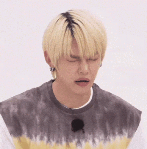 Young Man With Blonde Hair In Tie Dye Shirt Sad Face GIF