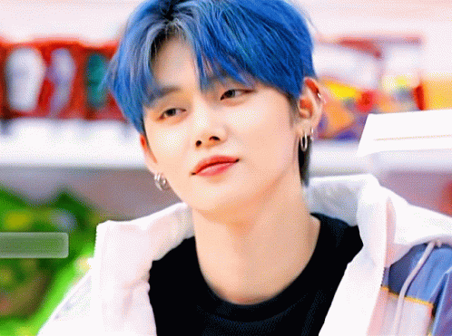 Young Man With Blue Hair and Earrings