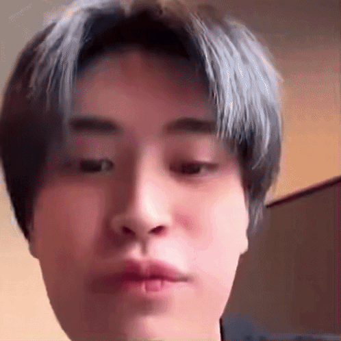 Young Man With Blue Hair Making Funny Face