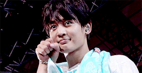 Young Man With Blue Towel Making A Face GIF