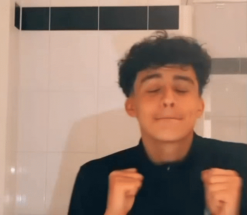 Young Man with Curly Hair Funny Face Tiled Wall