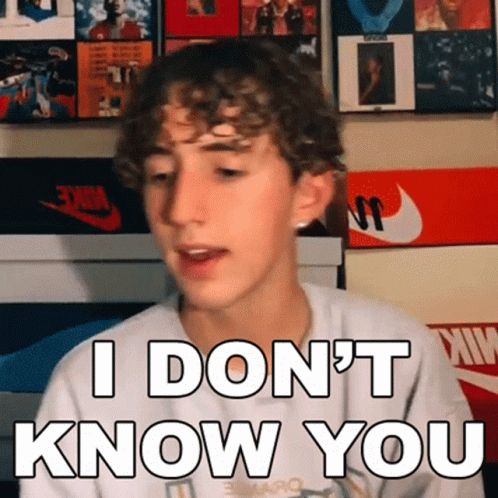 Young Man With Curly Hair Making Funny Face Saying I Don't Know You