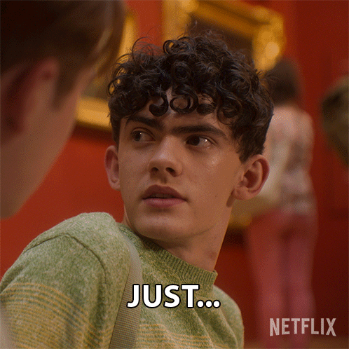 Young Man With Curly Hair Saying Just