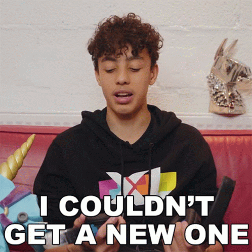 Young Man With Curly Hair Sitting On Couch GIF