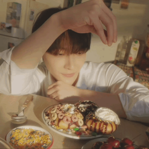 Young Man With Donuts and Cereal