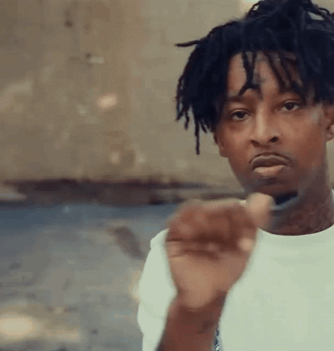 Young Man With Dreadlocks And Face Tattoo Pointing At Camera GIF