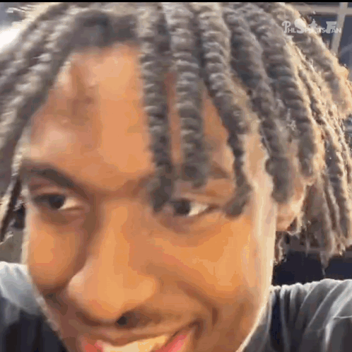 Young Man with Dreadlocks Smiling