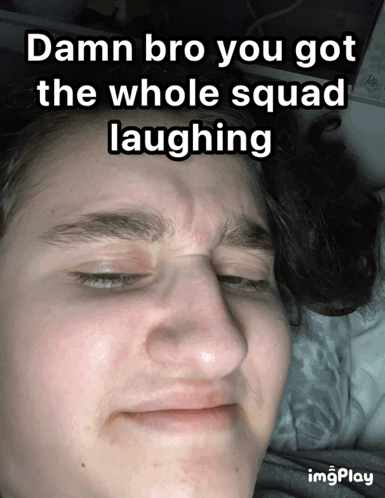 Young Man with Eyes Closed and Laughing Caption