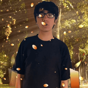 Young Man With Glasses and Black Shirt Among Trees