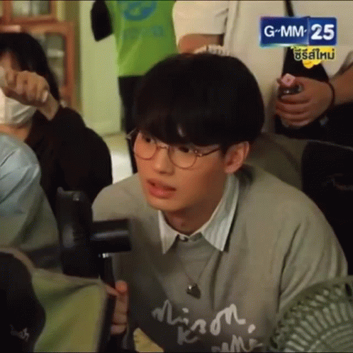 Young Man With Glasses And Gray Sweater GIF