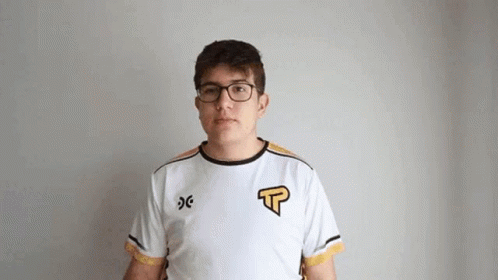 Young Man With Glasses And White Shirt Looking At Camera GIF